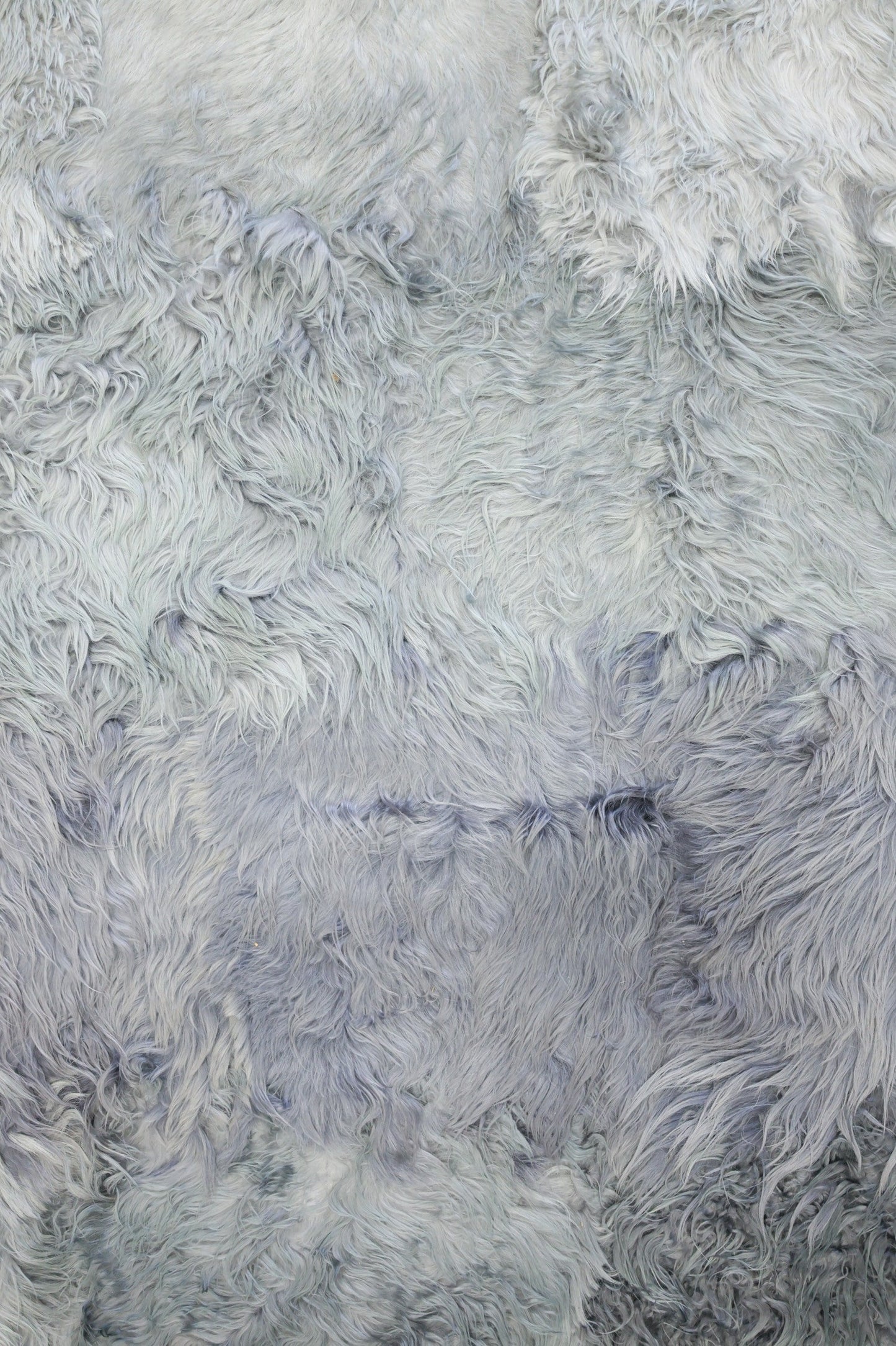 Soft, silvery-grey angora rug texture; ombre shading.
