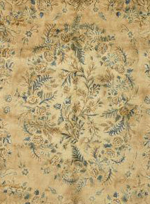 Beige antique Kerman rug detail, featuring a floral medallion design in muted blues and browns.