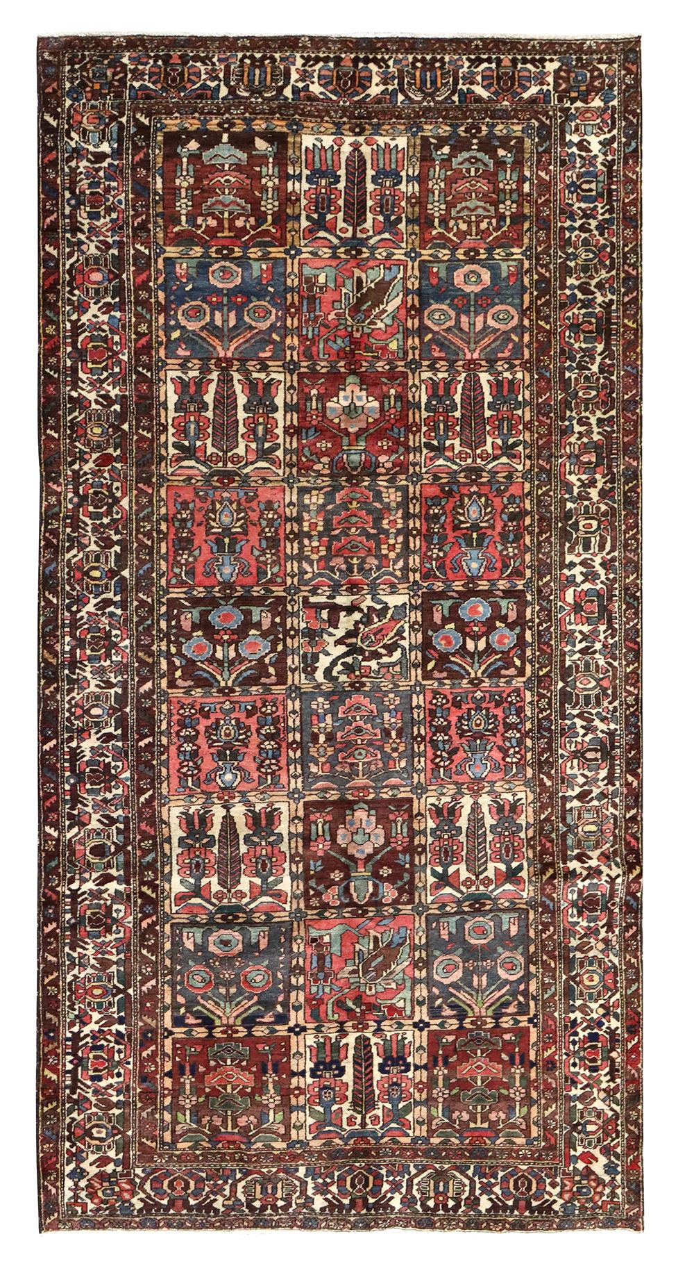 Antique Bakhtiari rug J67881: Handwoven tribal rug with intricate floral and geometric patterns in rich reds, blues, and creams.
