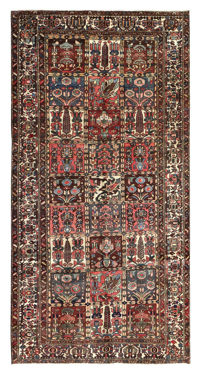 Antique Bakhtiari rug J67881: Handwoven tribal rug with intricate floral and geometric patterns in rich reds, blues, and creams.
