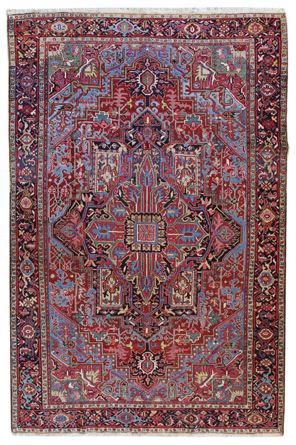 Antique Heriz Tribal Rug JF8036: Red, blue, and ivory wool hand-knotted rug with intricate medallion design.
